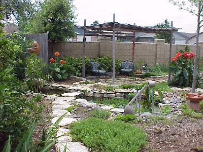 Karen Richardson designed and built this pond. EF cleaned it and replaced a pump.